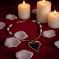 Hearts Desire handmade necklace with rose gold heart and gemstone beads in a romantic setting